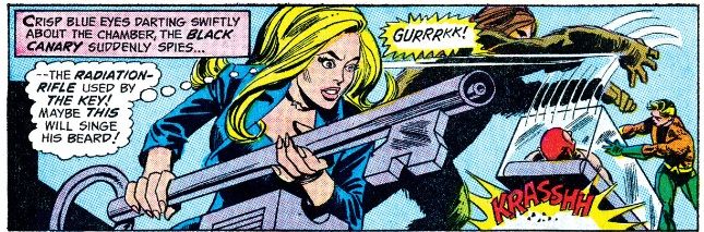 Black Canary thinks about how to stop Shaggy Man from beating up Aquaman. In the background, Shaggy Man snarls.