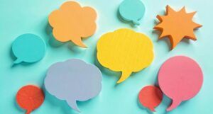 Image of several colorful speech bubbles on a teal background